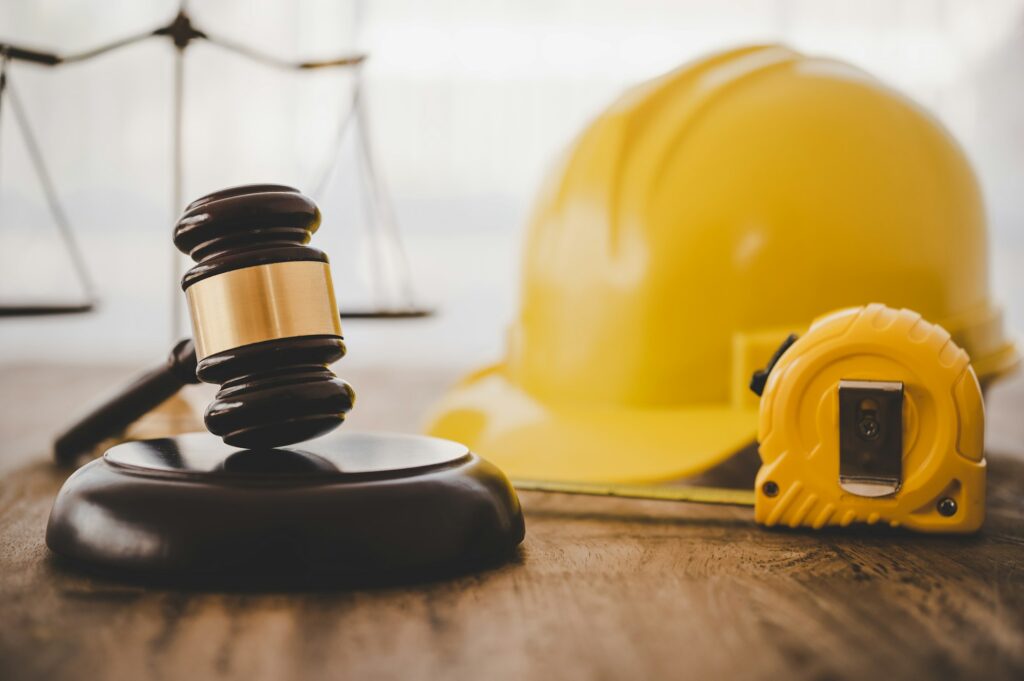 Judge's hammer and helmet Law and Justice about labor law concept Construction law.